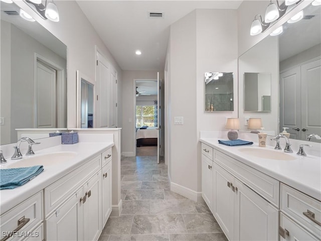 bathroom featuring vanity and ceiling fan