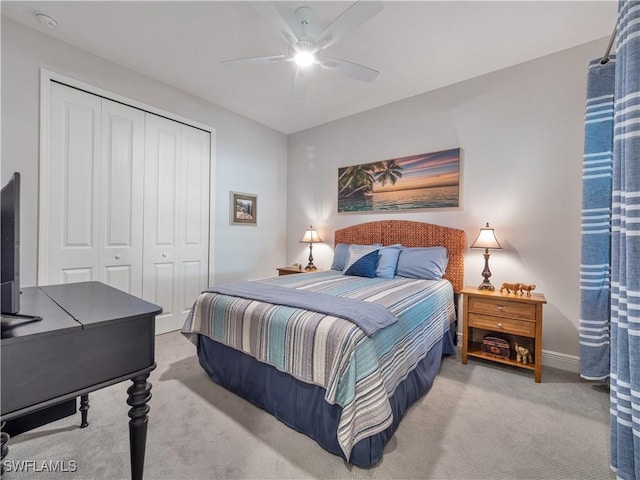 carpeted bedroom with a closet and ceiling fan