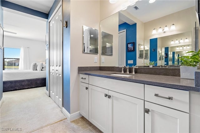 bathroom with vanity and tile patterned floors