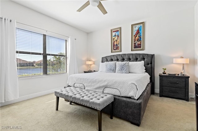 bedroom with light carpet and ceiling fan