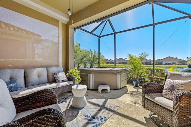 view of patio featuring outdoor lounge area, a hot tub, and a lanai