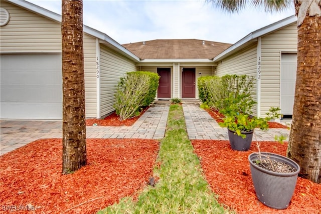 entrance to property featuring a garage