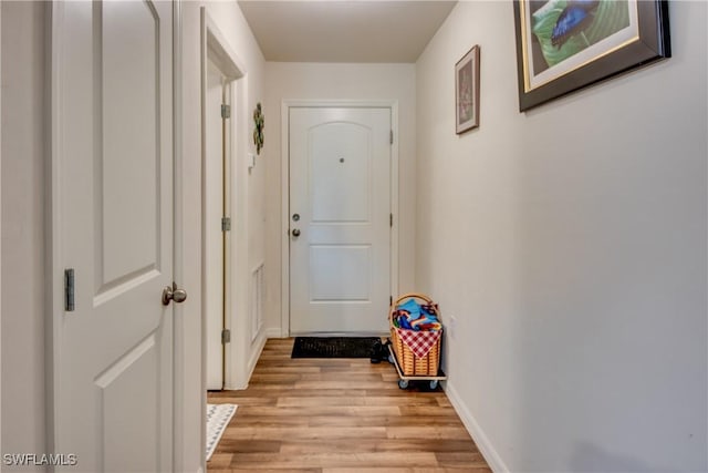 doorway with light hardwood / wood-style floors