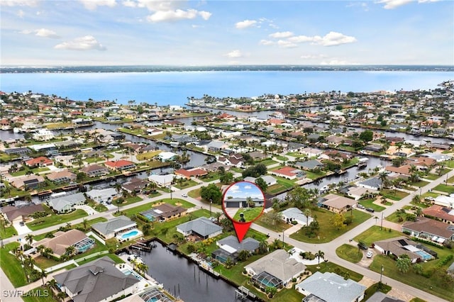 aerial view with a residential view and a water view