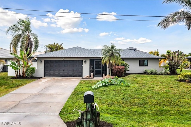 single story home featuring a garage, a front yard, and central AC unit