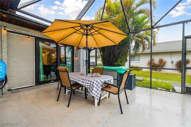 view of patio featuring a lanai