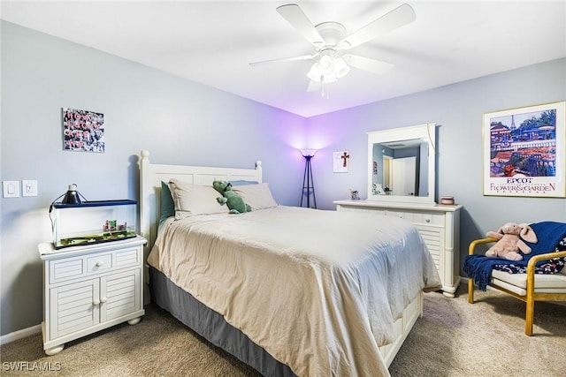 bedroom featuring carpet flooring, a ceiling fan, and baseboards