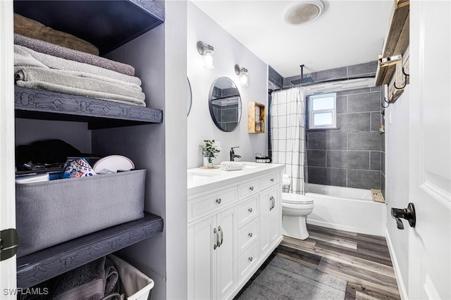 full bathroom featuring wood-type flooring, toilet, vanity, and shower / bath combo