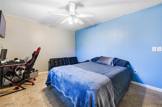 bedroom with ceiling fan, carpet flooring, and baseboards