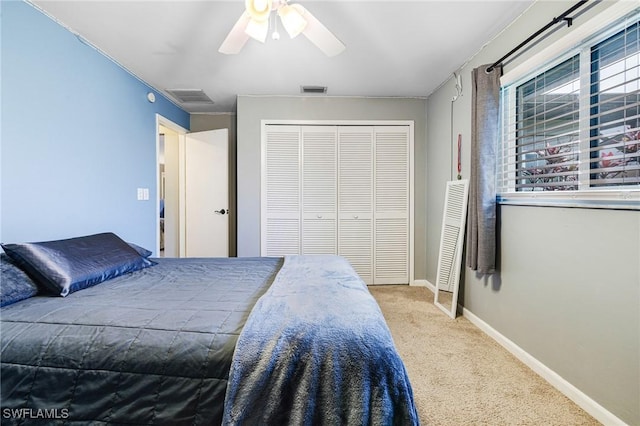 bedroom featuring carpet flooring, a closet, and ceiling fan