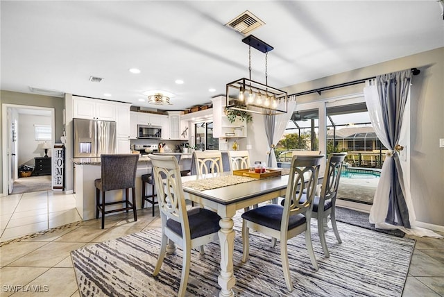 dining space with light tile patterned floors