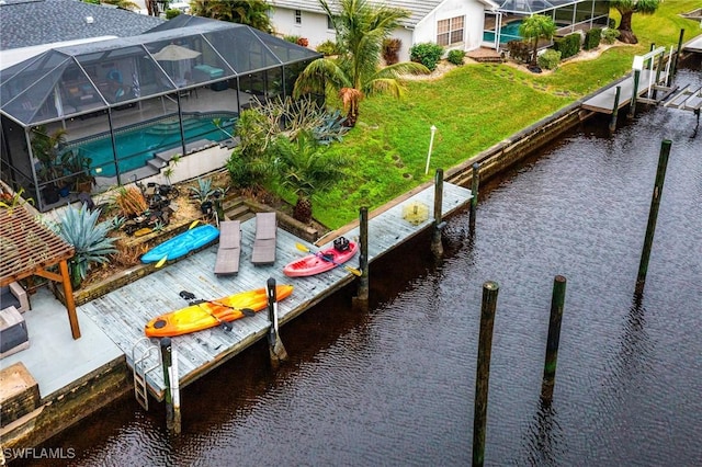 dock area with glass enclosure, a water view, and an outdoor pool