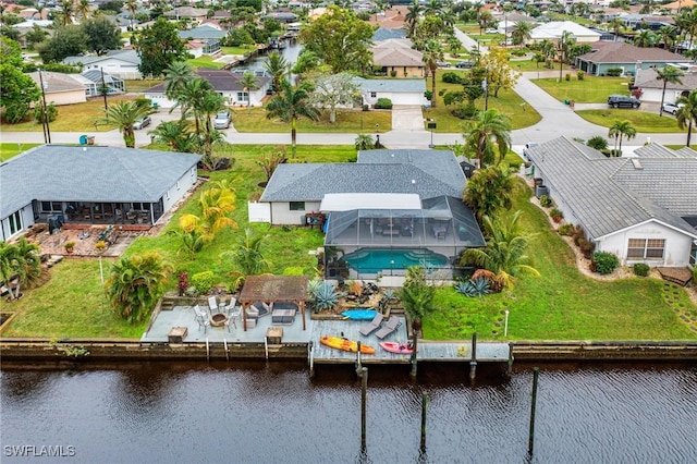 drone / aerial view with a water view