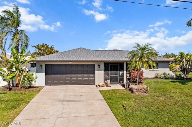 ranch-style house with an attached garage, driveway, a front yard, and stucco siding