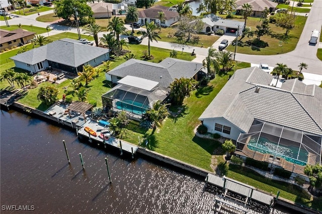 bird's eye view featuring a residential view and a water view