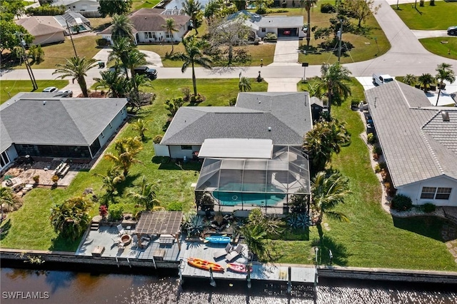 bird's eye view featuring a water view and a residential view