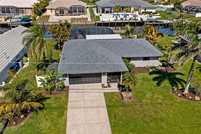 birds eye view of property featuring a water view