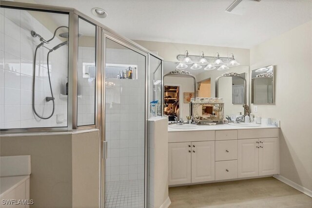 bathroom featuring vanity, hardwood / wood-style flooring, and an enclosed shower