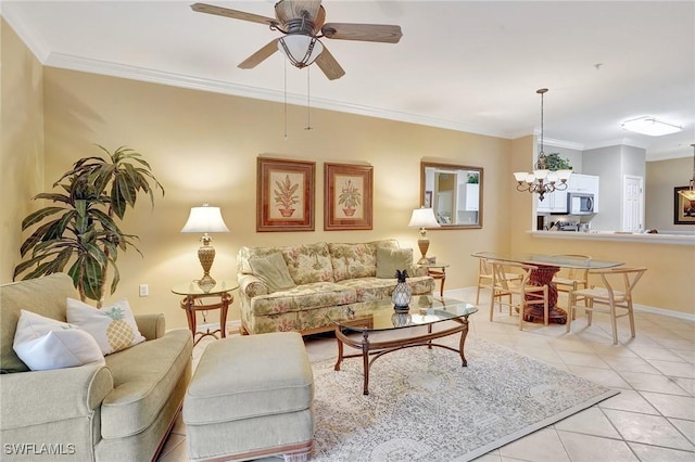 living room with crown molding, light tile patterned flooring, and ceiling fan with notable chandelier