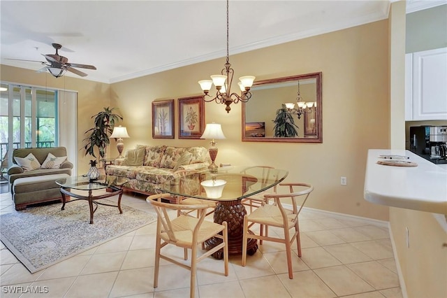 tiled dining area with ceiling fan with notable chandelier and ornamental molding