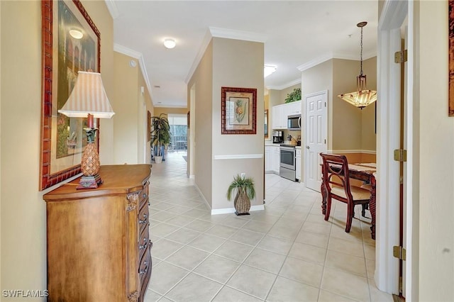 corridor featuring ornamental molding and light tile patterned floors