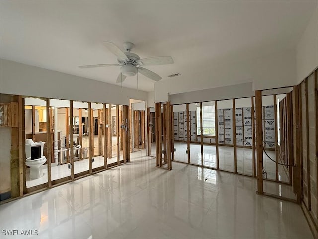 interior space with ceiling fan and light tile patterned floors