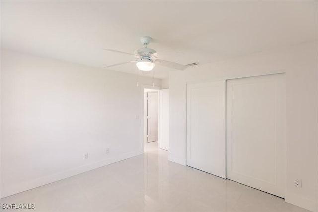 unfurnished bedroom with a closet and ceiling fan