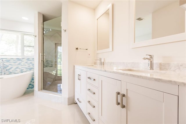 bathroom with separate shower and tub and vanity