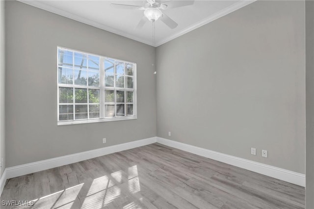 empty room with crown molding, ceiling fan, and light wood-type flooring