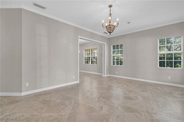 unfurnished room featuring crown molding and a notable chandelier