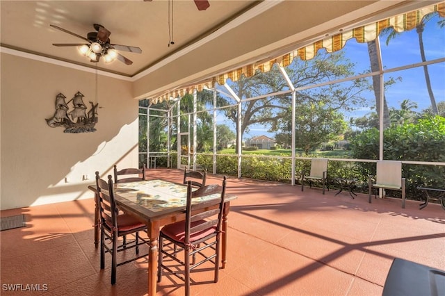 view of patio with a lanai and ceiling fan