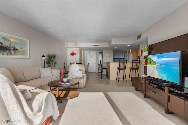 living room with a textured ceiling