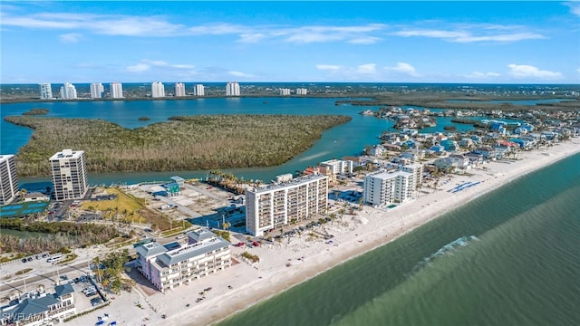 birds eye view of property featuring a water view and a view of the beach