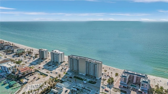 bird's eye view featuring a water view and a view of the beach