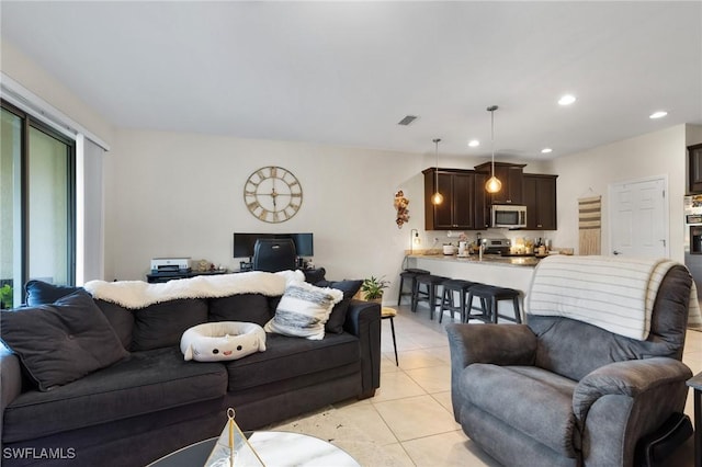 living room with light tile patterned floors