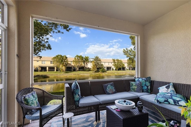 sunroom / solarium with a water view