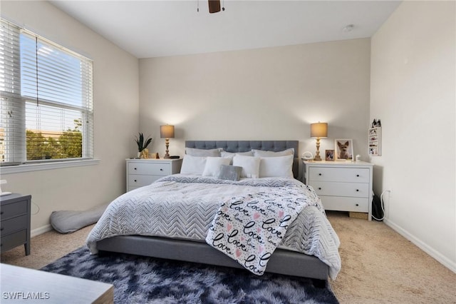 bedroom with light carpet and ceiling fan