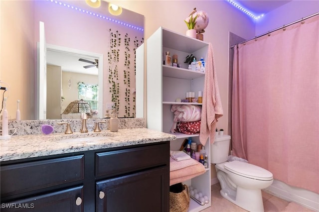 full bathroom with tile patterned floors, toilet, vanity, shower / bath combo, and ceiling fan