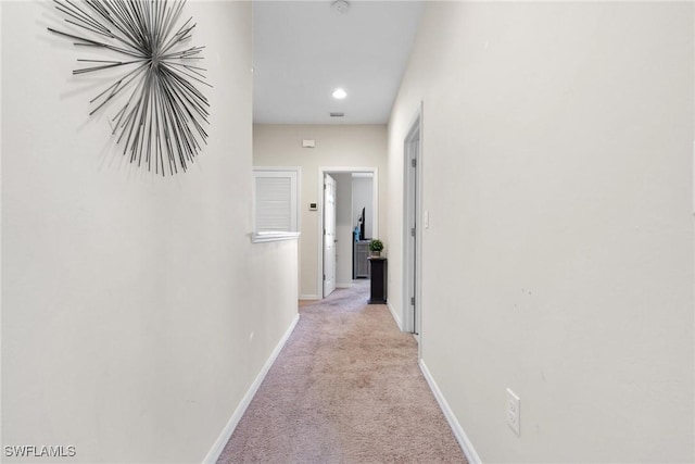 hallway with light carpet