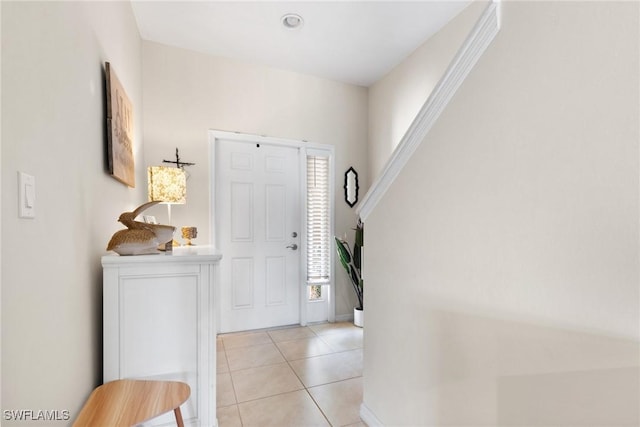 foyer featuring light tile patterned floors