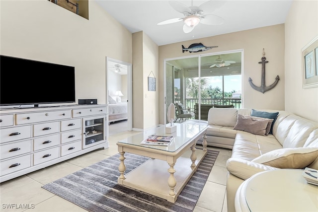 living room featuring ceiling fan and light tile patterned flooring