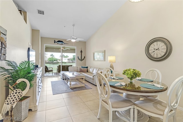 dining space featuring light tile patterned flooring and ceiling fan