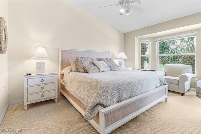 carpeted bedroom featuring lofted ceiling and ceiling fan