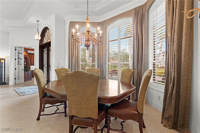 dining area featuring ornamental molding, light tile patterned floors, and a notable chandelier