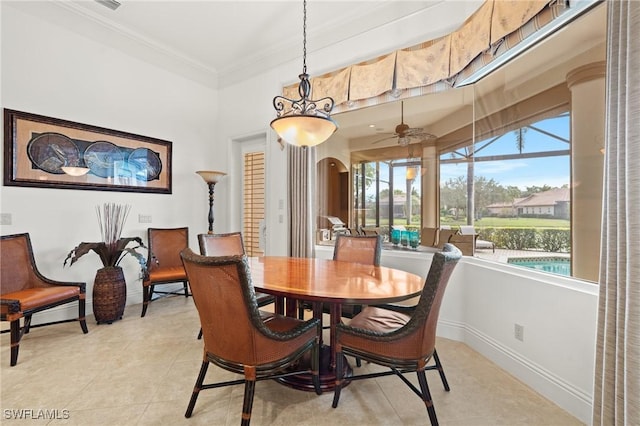 tiled dining room with crown molding