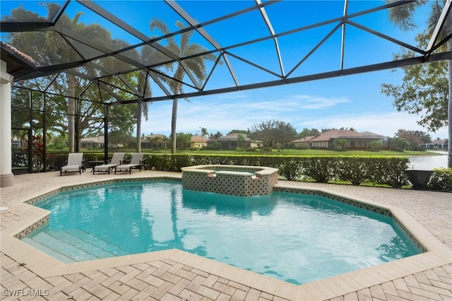 view of pool with an in ground hot tub, a patio, and glass enclosure