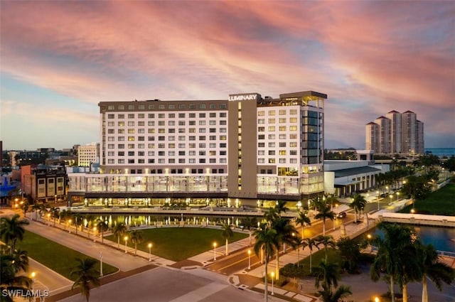 view of outdoor building at dusk