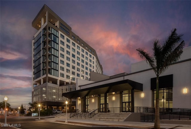 view of outdoor building at dusk