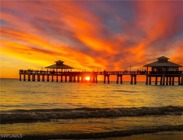 view of dock featuring a pier and a water view