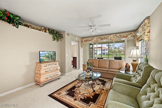 living room with ceiling fan and carpet floors